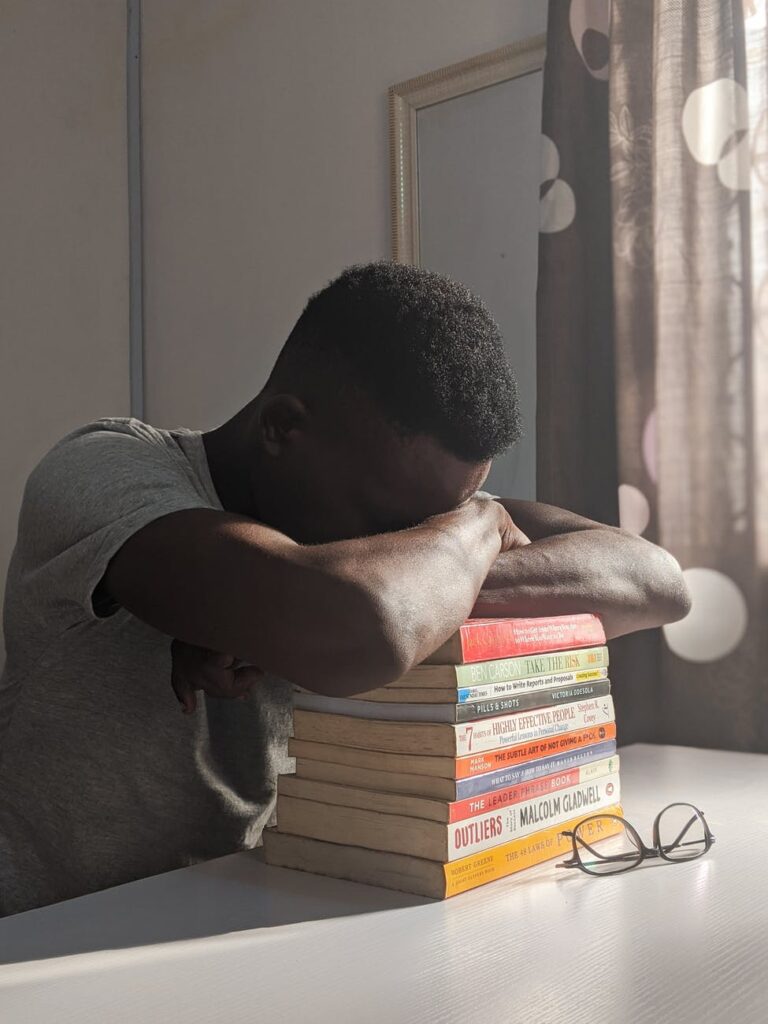 man napping on books